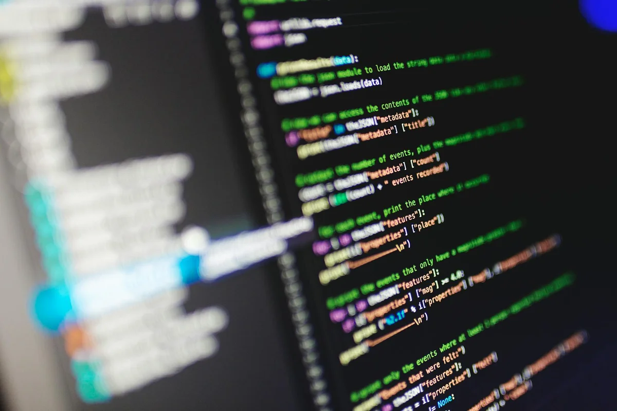 Repositorio de conocimiento con IA: convierte tu negocio en... — Close-up of a computer screen displaying colorful programming code in JavaScript